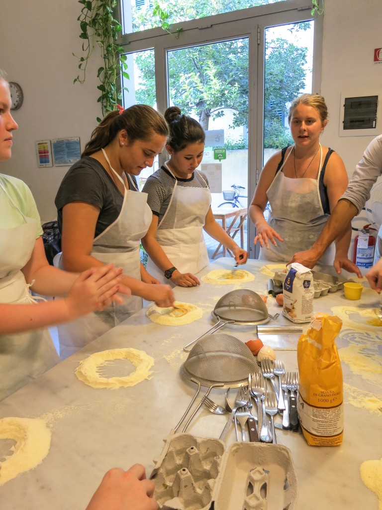 The girls getting ready to crack the egg and get their hands dirty